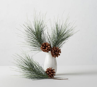 White vase with winter greens - How to freshen up your home when the holidays are over - Western Mass Interior Design