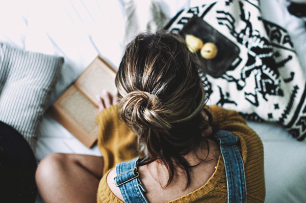 Girl Reading a Book - Create a Peaceful Reading Nook - Details Interiors - Interior Design Near Me